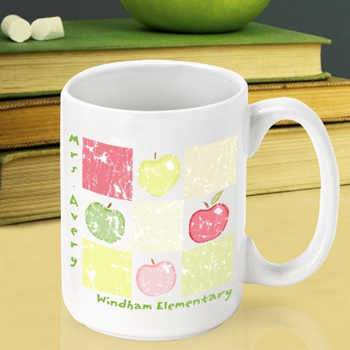 Now a great teacher can enjoy an apple every day! Be sure to surprise a teacher with an apple at the end of the school year! Our Patchwork Apples mug is too cute to pass up and will look great sitting on a teacher's desk. This white ceramic mug has a pat #mug