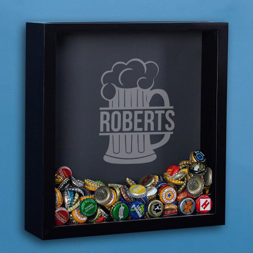 We all have that one friend with bottle caps all over the floors and table tops, or you may be the guilty party yourself. Put those bottle caps to better use with this personalized beer cap shadow box! This custom shadow box comes engraved with a large fr #mug