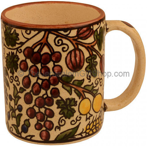 Hand painted Armenian ceramic beige 'Seven Species' mug. Made in Jerusalem.Size: 4 inches / 10cm high. Lead free. Dishwasher safe. A land of wheat, and barley, and vines, and fig trees, and pomegranates; a land of olive oil , and honey (Deuteronomy 8:8) S #mug