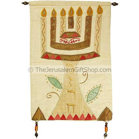 Beautifully embroidered with silk this Menorah with 'Mizrach' written in Hebrew on an off-white background would look stunning on the wall of your home or church. Size: 12.5 x 18 inches.Mounting pole made from Brass. Written on the menorah stem in Hebrew #silk