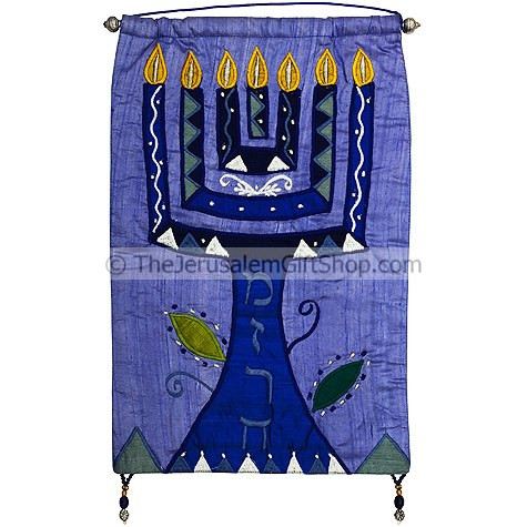 Beautifully embroidered with silk this Menorah with 'Mizrach' written in Hebrew on a blue background would look stunning on the wall of your home or church. Size: 12.5 x 18 inches.Mounting pole made from Brass. Written on the menorah stem in Hebrew is Miz #silk