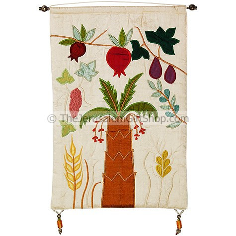 Seven Species Raw Silk Wall Hanging designed by the renowned Israeli artist Yair Emanuel at his art studio in Jerusalem. This beautiful wall hanging features a date palm rising up in the middle of wheat and barley blooming on each side with pomegranates, #silk
