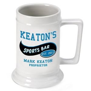 This ceramic mug makes an excellent gift for the sports fanatic! He can use our personalized Sports Bar Beer Stein to enjoy a brew while he cheers on his favorite team! Made of dishwasher safe ceramic this stein holds up to 16 ounces. A great gift for an #bar
