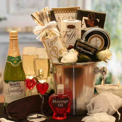 All the essentials for an evening of true romance for all of the senses are packed in a champagne bucket. Any couple is going to have a great date night when they start with this romantic basket. This romantic gift basket features everything you need to d #gift