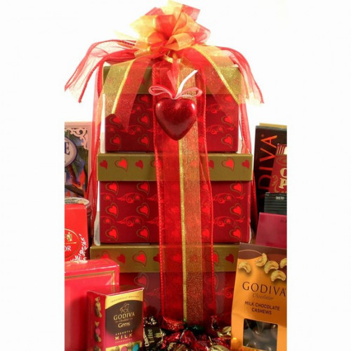 This Valentine gift tower will treat them to some of our most popular gourmet gifts in this eye catching three-tier gift tower! It includes a heart gift tie. Contents of the top box include: S'more Bark, Cranberry Toffee Chocolate Bark, Triple Chocolate T #gift