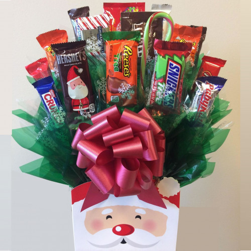 A Santa box holds a bouquet of full and fun size candy bars and candies staged to look like a flower arrangement. Santa Claus has arrived with a sleigh full of candy favorites! Our Santa Bouquet is perfect for everyone on your holiday gift list. This Sa #gift