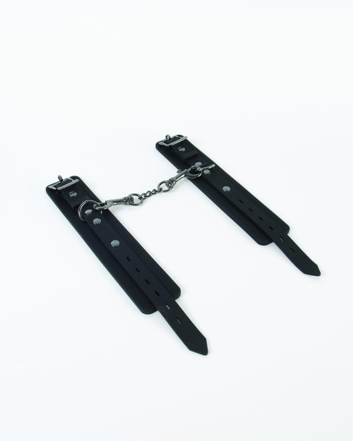 Soft silicone cuffs where resistance is futile. Featuring heavy duty buckle and multi-use dog clips, these cuffs can be attached to other restraints for unlimited ways to play. With gunmetal plated detailing, wipe clean surface and lockable pin, these c #sex