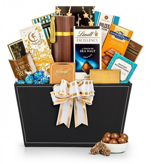 A generous display for the chocolate lover on your gift list! Tempt and delight the chocolate lover on your list with a decadent array of premium confections! Beautifully presented in an elegant willow attache, our Chocolate Temptations Gift Basket will b #gift