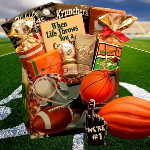 A Great Gift For any Sports Fan! A great gift basket for the avid sports fanatic! Loaded with treats for the participant, or the fan. Everyone will enjoy all the cool treats and gifts jammed in this one! #gift