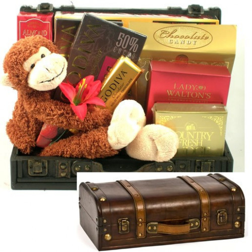 This stylish wooden trunk arrives with a selection of some our most sought after gourmet goodies along with one very cute stow-away, Mojo, an adorable plush monkey with Velcro on his paws, making him perfect for hugging! Contents include: Buttercrunch Tof #gift