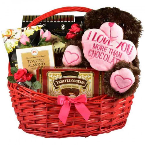 This extra large gift basket arrives in the company of an over-sized plush pup too cute to resist! Mouthwatering sweets make this gourmet basket a standout gift. #gift