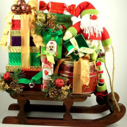Dashing Through The Snow Deluxe Christmas Gift Basket Sleigh totes gourmet sweets, crackers, sausage and cheese topped with a whimsical Santa. Send this beauty dashing through the snow to their doorstep for Christmas! This over-sized gift features a wonde #gift