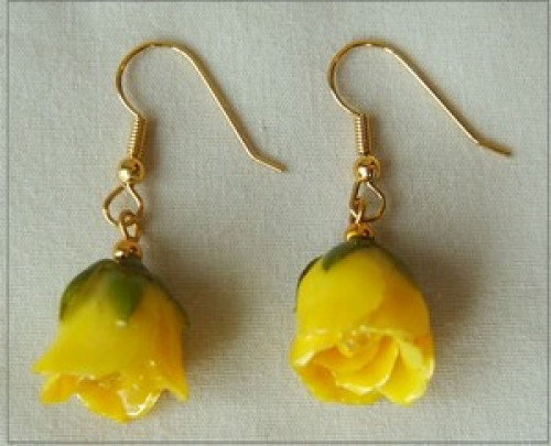 Miniature Yellow roses have been preserved in a clear lacquer finish and trimmed in gold. Rose earrings make great jewelry gifts. Check out our gold rose jewelry line for more unique gift ideas. #gift