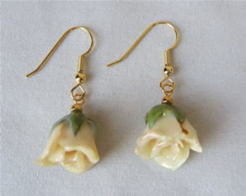 Original Rose Jewelry! These genuine white mini rose earrings will enhance her beauty. The miniature white roses have been preserved in a clear lacquer finish to allow them to be everlasting. They are trimmed in gold using a similar process to our gold ro #gift
