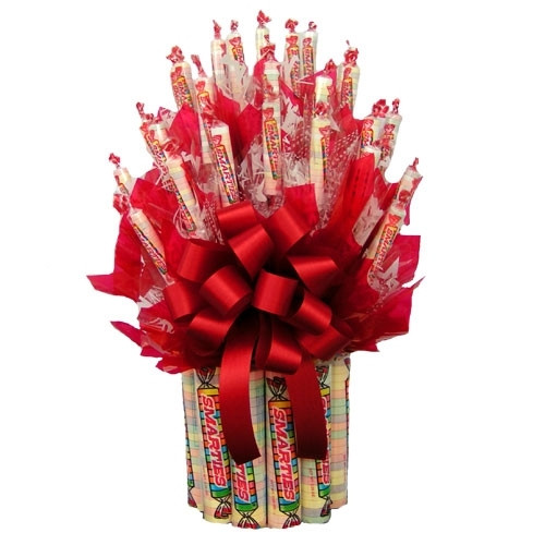 Our Smarties Candy Bouquet is the perfect gift for the smarty on your gift list. The bouquet features large and fun sized packages of Smarties candies arranged into a sweet and spectacular bouquet. This candy bouquet would make an excellent gift for a chi #gift