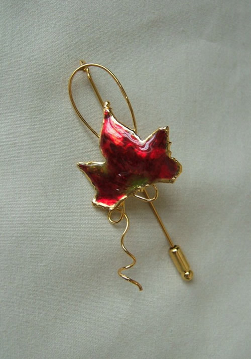 For the nature lover a miniature autumn red maple leaf has been picked at just the right time and then preserved in lacquer and trimmed with just the right amount of 24K gold to make an autumn red Maple Leaf Pin. This process is the same as the one used f #gift