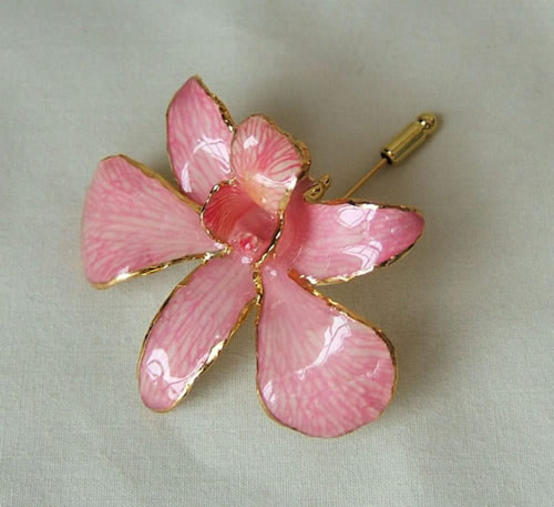 Picked at the peak of its natural perfection, a lush, exotic orchid blossom gives this Pink Dendrobium Orchid brooch its ethereal beauty. Each delicate, vibrant flower is skillfully preserved in lacquer and trimmed with touches of 24K gold. The Pink Orchi #gift