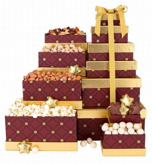 An elegant stack of delicious snack surprises. An elegant holiday tower of six delicious snack surprises! These keepsake boxes are packed with favorite Christmas snacks and make the perfect holiday party hostess gift! You can certainly check someone off #gift