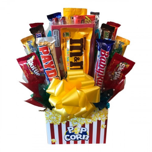 Movie night just got even better with our Movie Night Candy Bouquet. A microwaveable popcorn bag is arranged with an assortment of classic candies and chocolate for the perfect compliment to their favorite movie. Now they can kick up their heels with a fl #candy