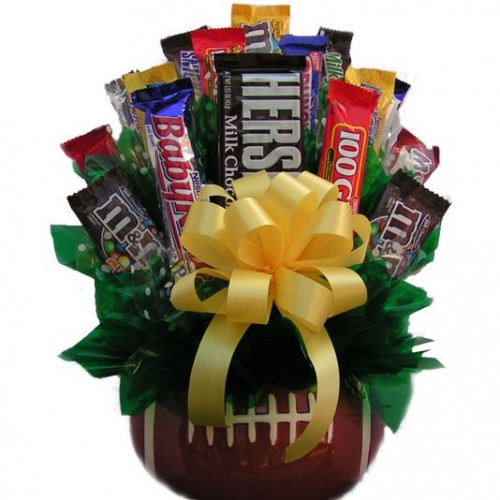 An assortment of chocolate and candy classics are artfully arranged in a ceramic football vase perfect for any gridiron fan. The Football Candy Bouquet makes a terrific gift for any occasion. Give one to Dad on Father's Day or send one to Grandpa on his b #candy