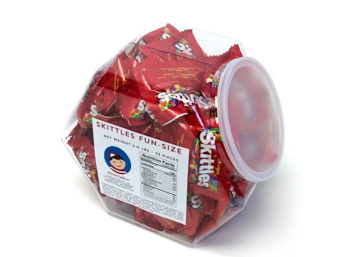 Skittles are small chewy candies in a package of original fruit flavors which are grape, lemon, green apple, orange and strawberry. This plastic, reusable tub measures over 7 inches high, 8 inches wide and 5 inches deep. The mouth is 4.5 inches in diamete #candy