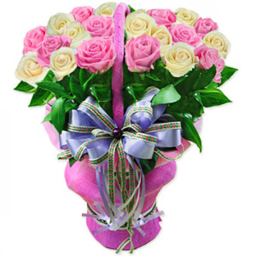 Of high renown, this stunning and sophisticated arrangement of pink and cream roses surrounded by greenery, tied with a fancy ribbon and arranged in a fancy basket, makes a dazzling addition to your loved ones day. #luxury